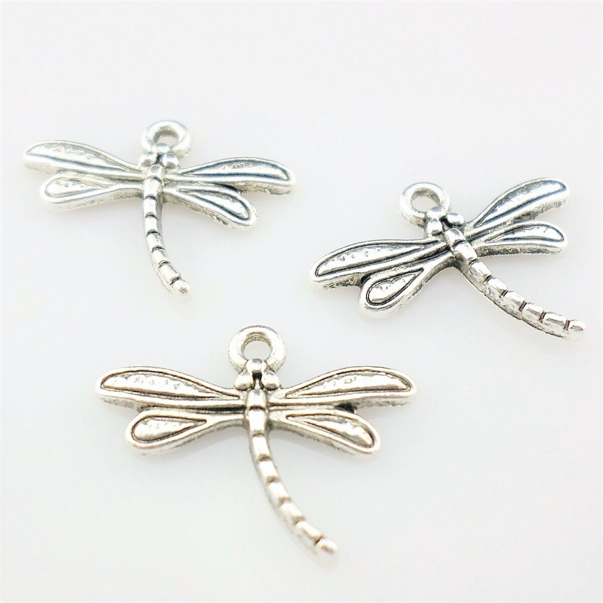 Dragonfly charm lots, curved body dragonfly silver one sided mix