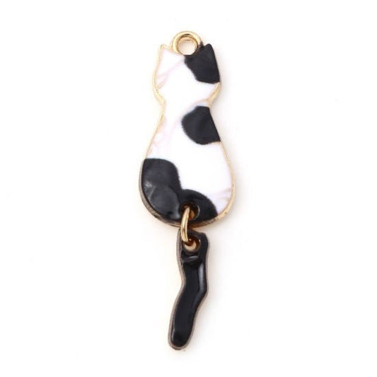 Black and white cat with moveable tail dangle charm , enamel cat white with black spots with gold plated back