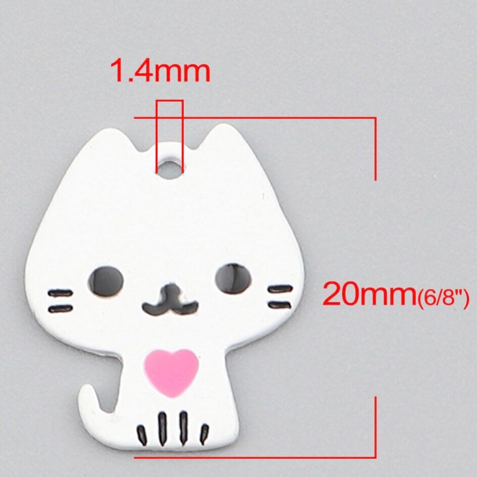 White cat charm. painted metal  cat with heart, back is white